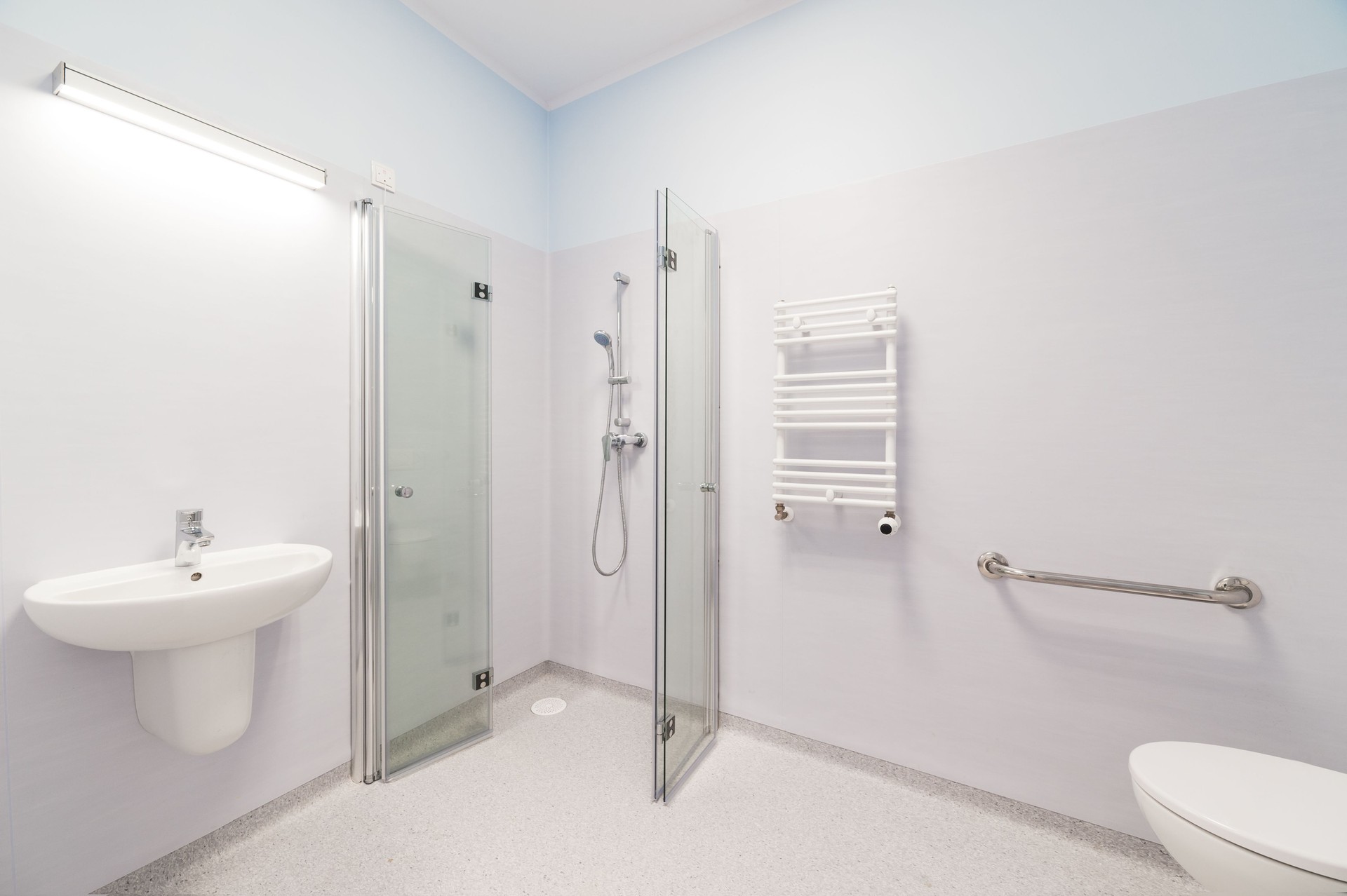 Modern Accessible Bathroom with Shower, Sink and Toilet